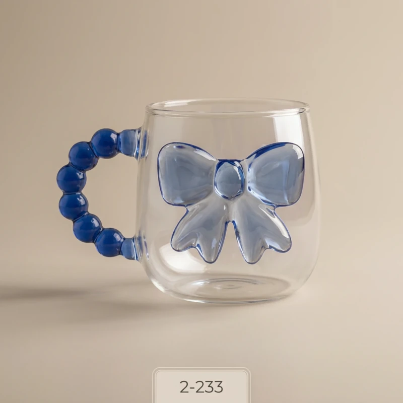 العنوان: كوب أطفال شفاف بفيونكة ومقبض أزرق